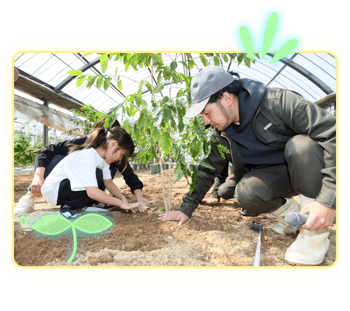 植物を植えている、男性と子供